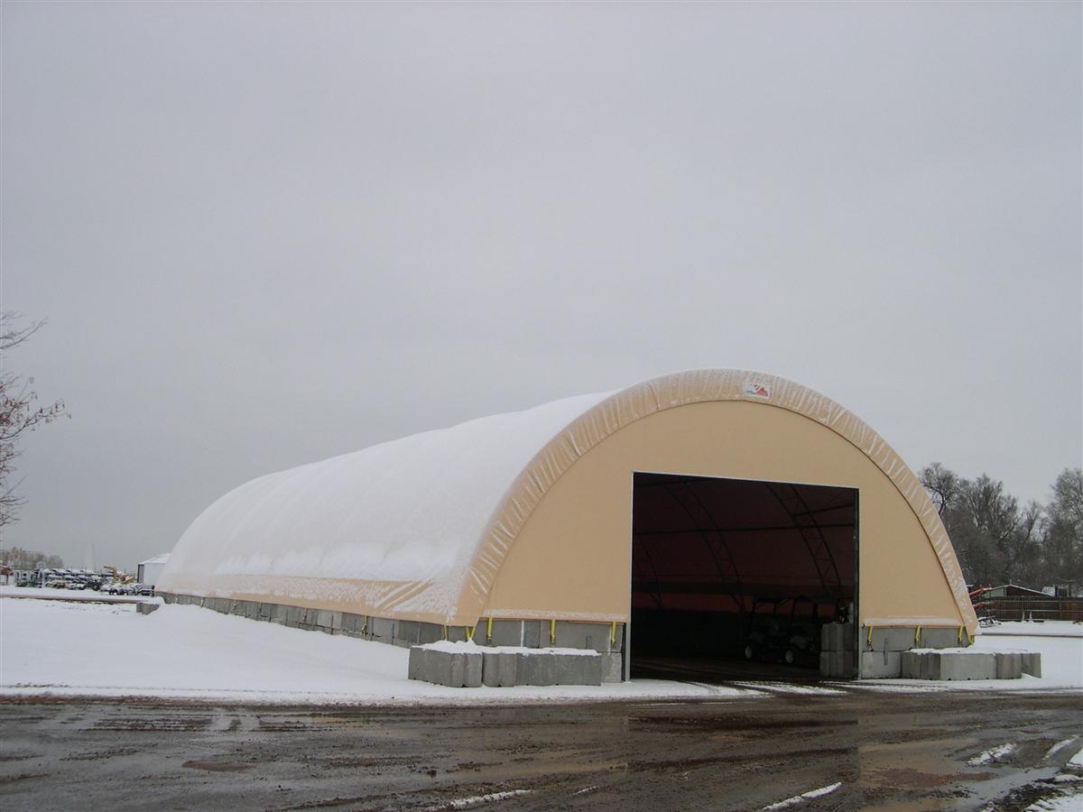 Beige Round HD building covered in snow
