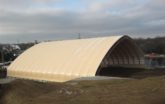 Beige Fabric building for Charcoal Storage