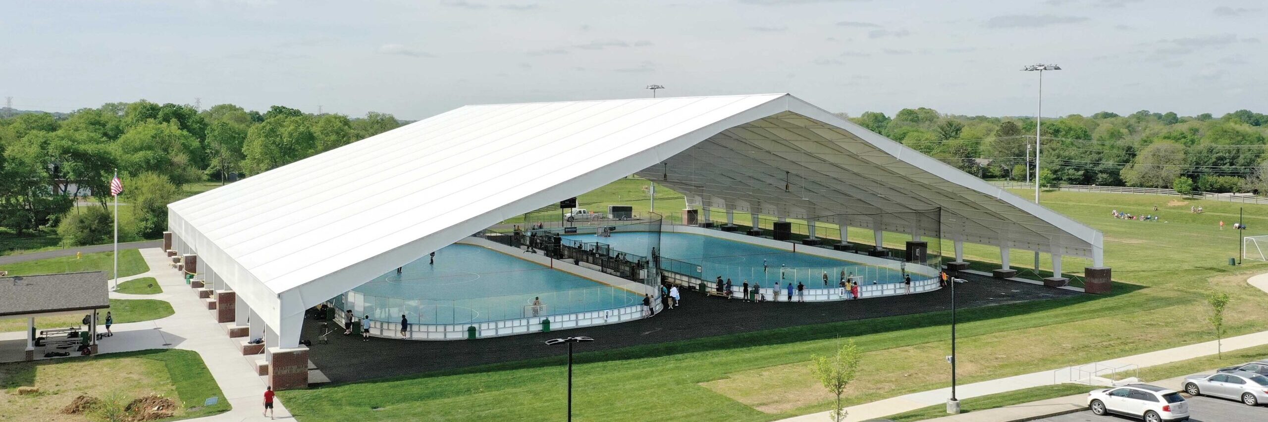 fabric I-beam pavilion building with floor hockey rinks