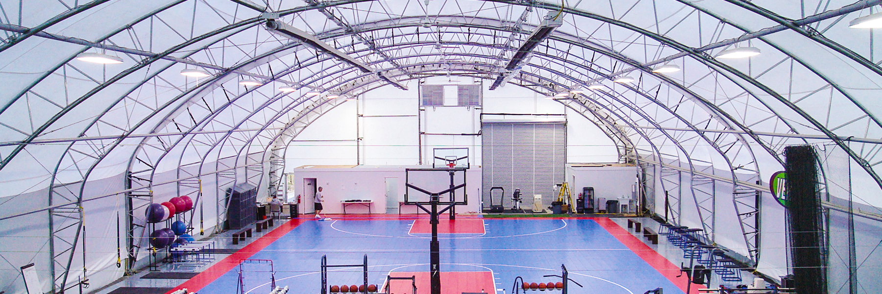 Basketball court and gym under a fabric structure