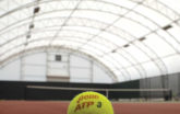 Tennis Athletic Building close up on a tennis ball