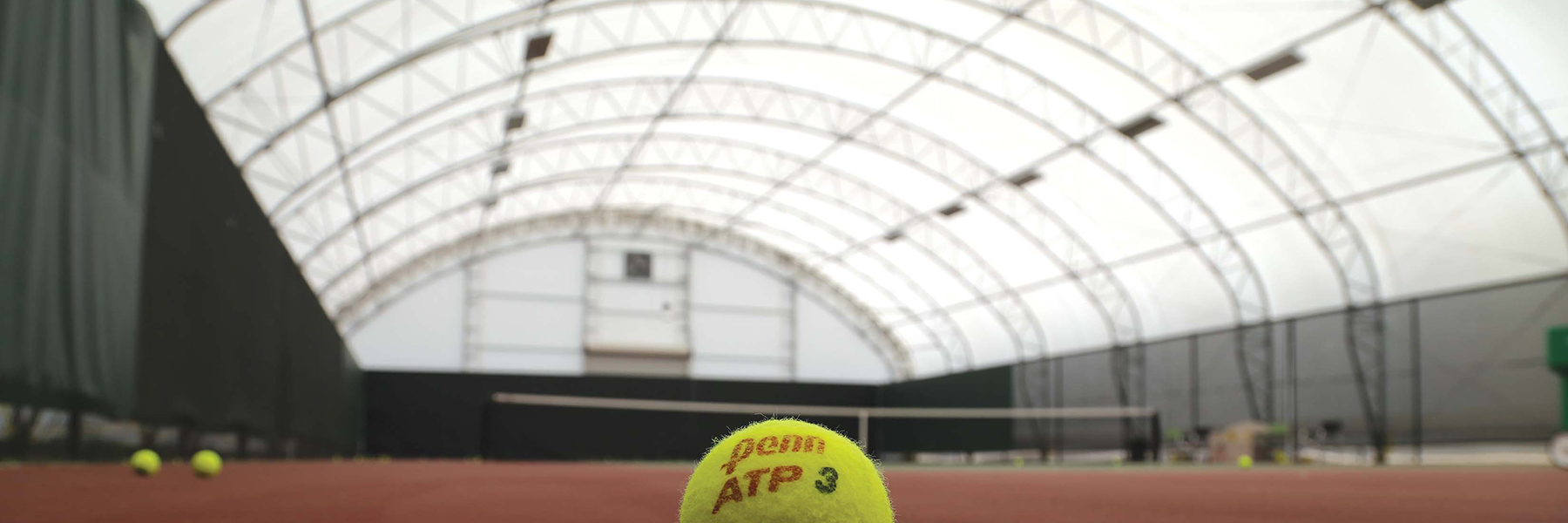 Tennis Athletic Building close up on a tennis ball