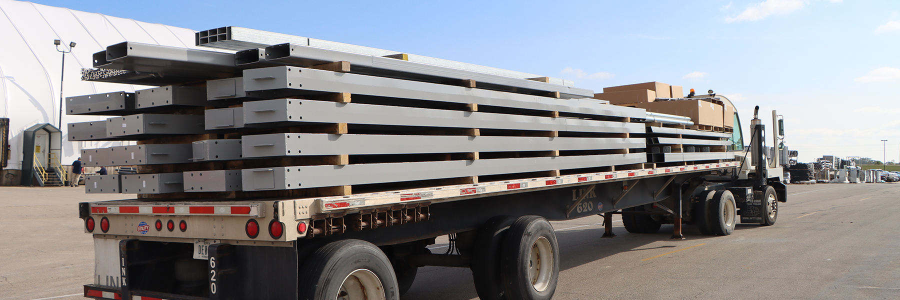 Multiple PPG Painted Beams on the back of a flat bed truck