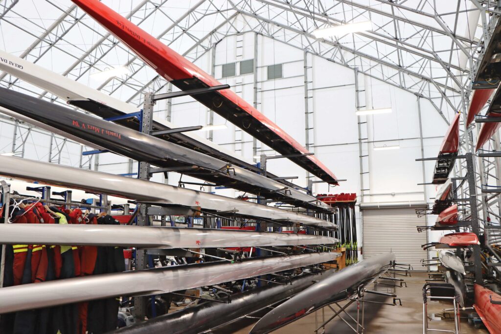 rowing equipment stacked inside fabric storage tent