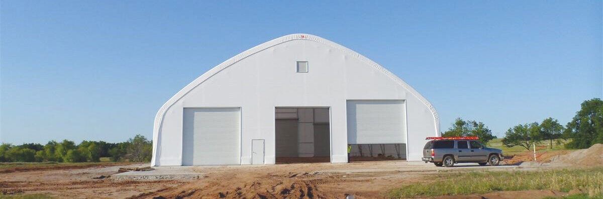 fabric building with garage style doors