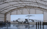 plane parked outside of plane hangar