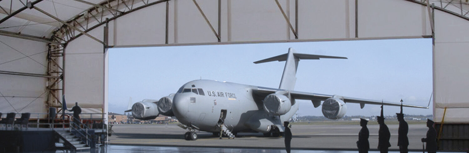 plane parked outside of plane hangar