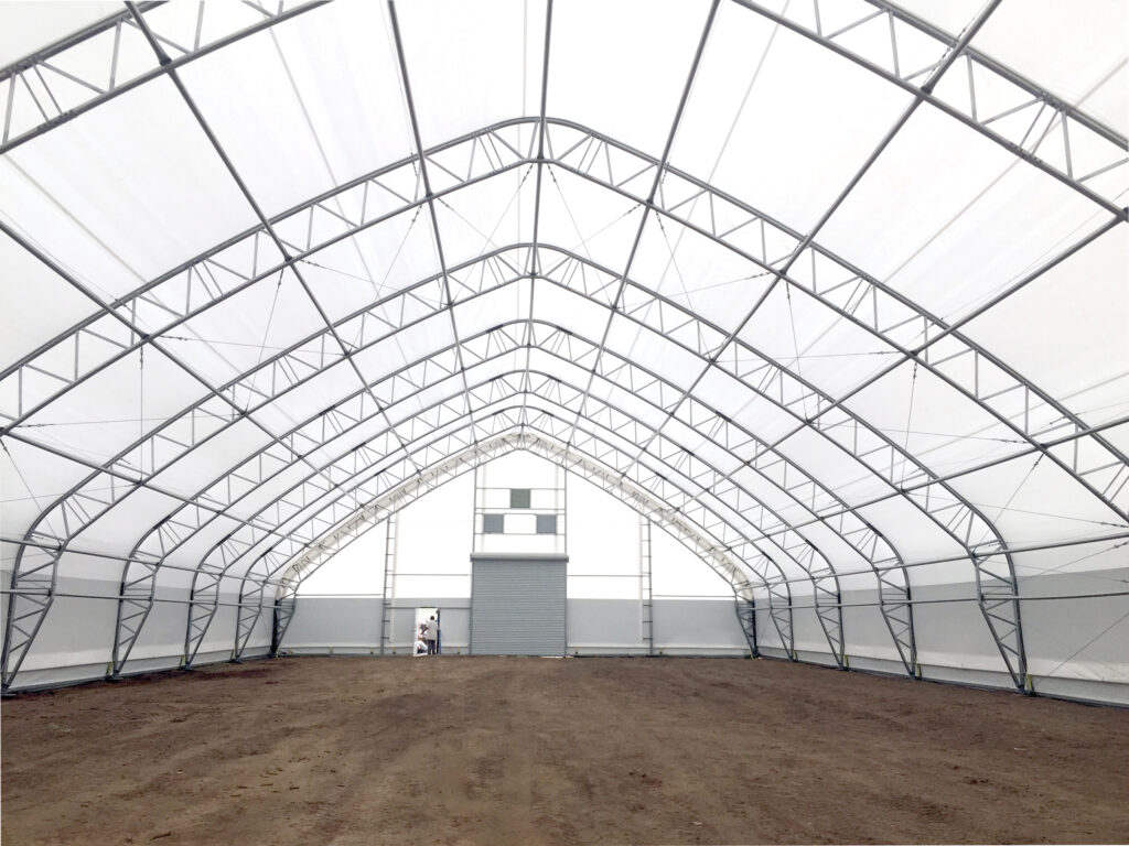 inside fabric structure with dirt floor