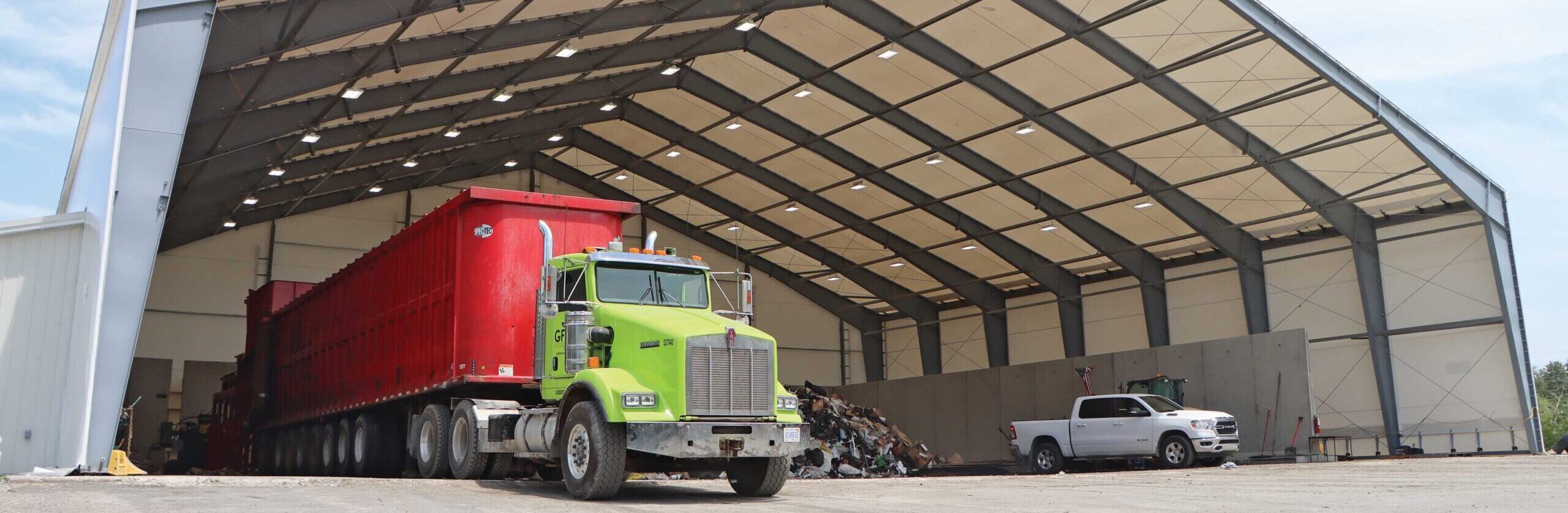 Beam Fabric Building with vehicles underneath