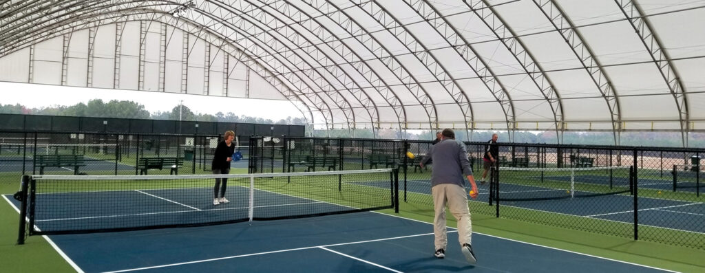 Inside Fabric Building Pickleball Facility