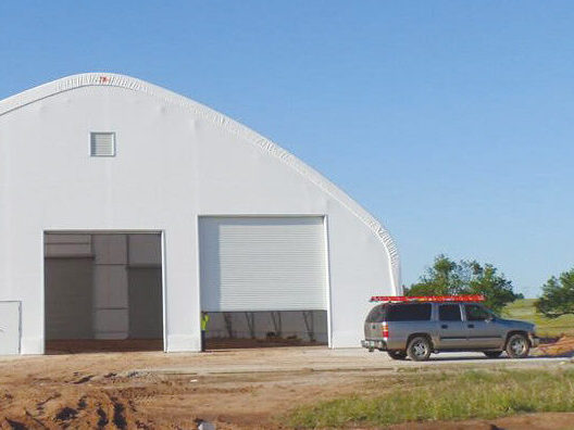 fabric building with garage style doors