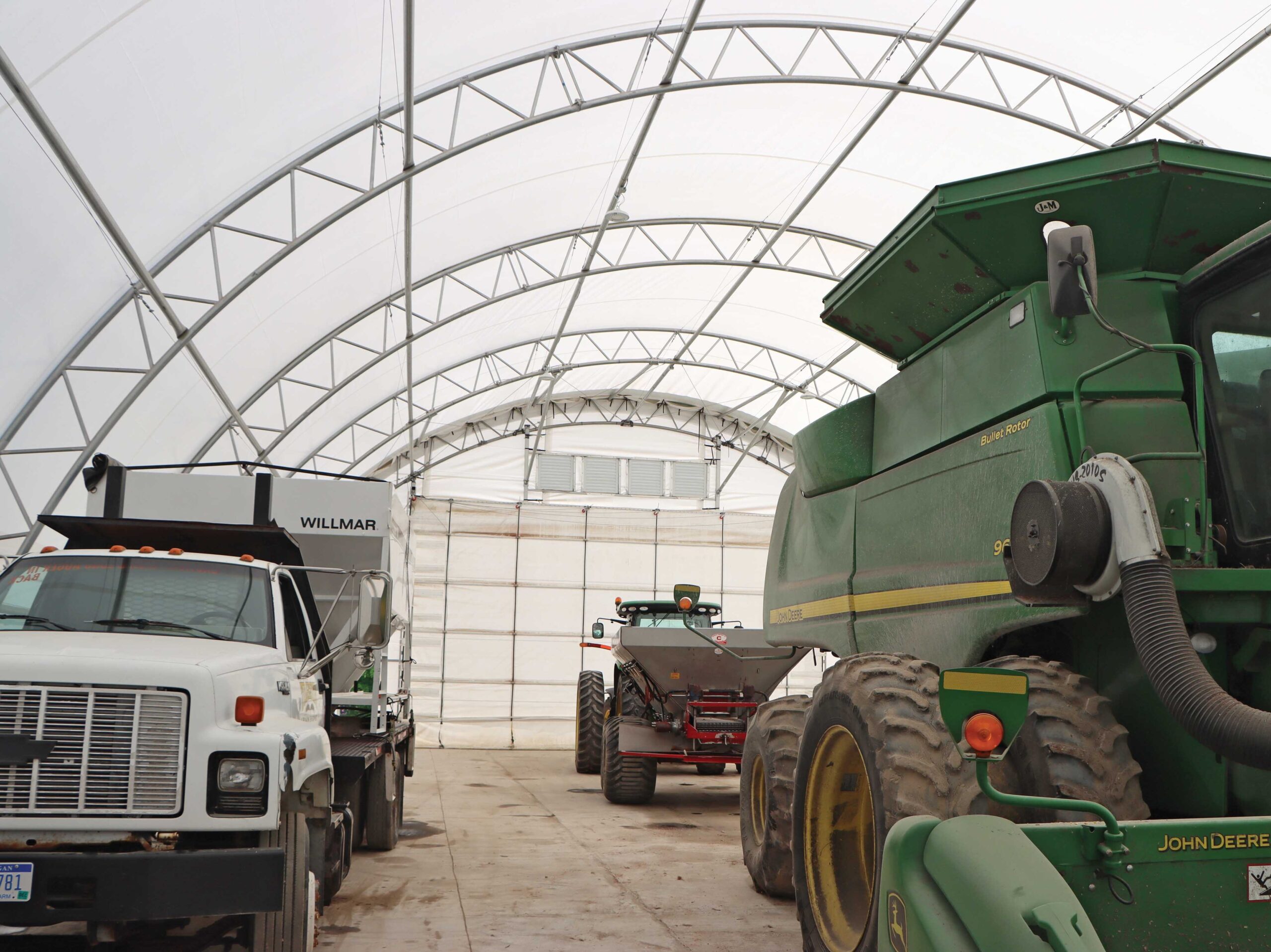 vehicles stored in fabric garage building