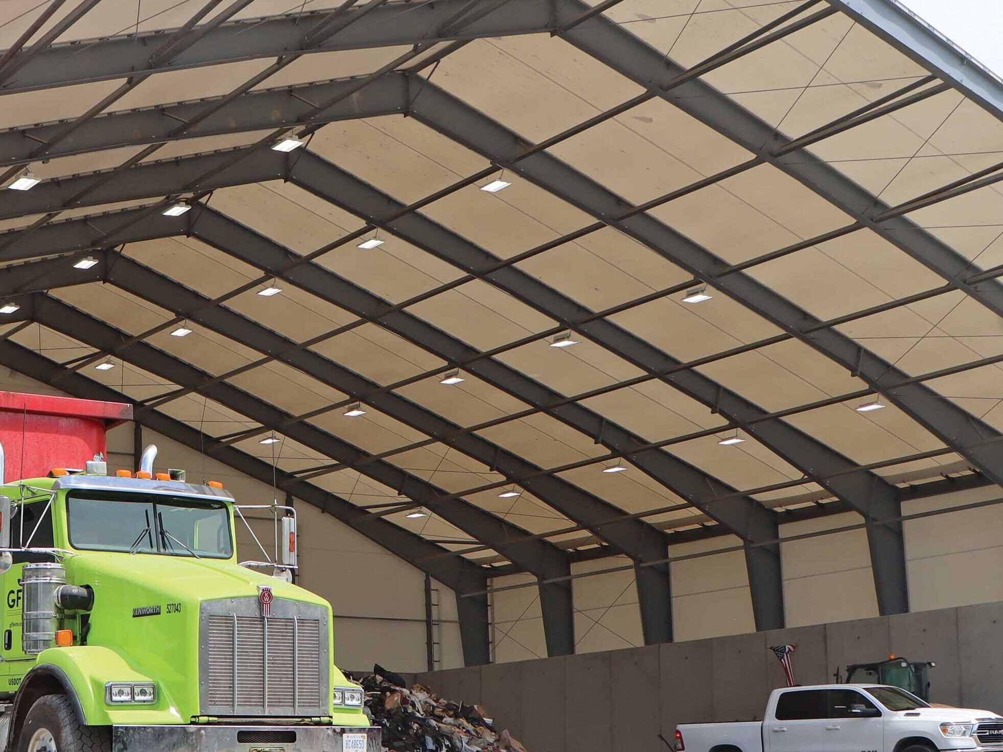 Beam Fabric Building with vehicles underneath