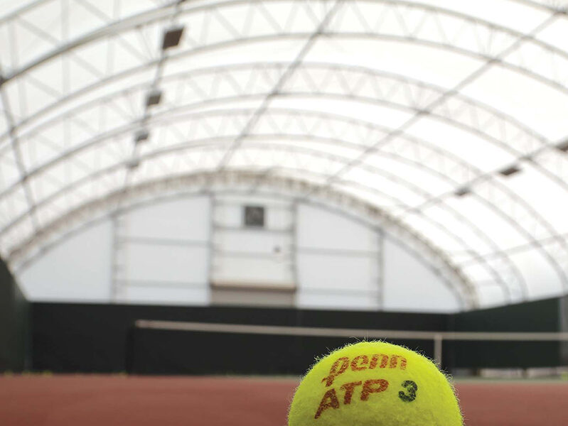 Tennis Athletic Building close up on a tennis ball