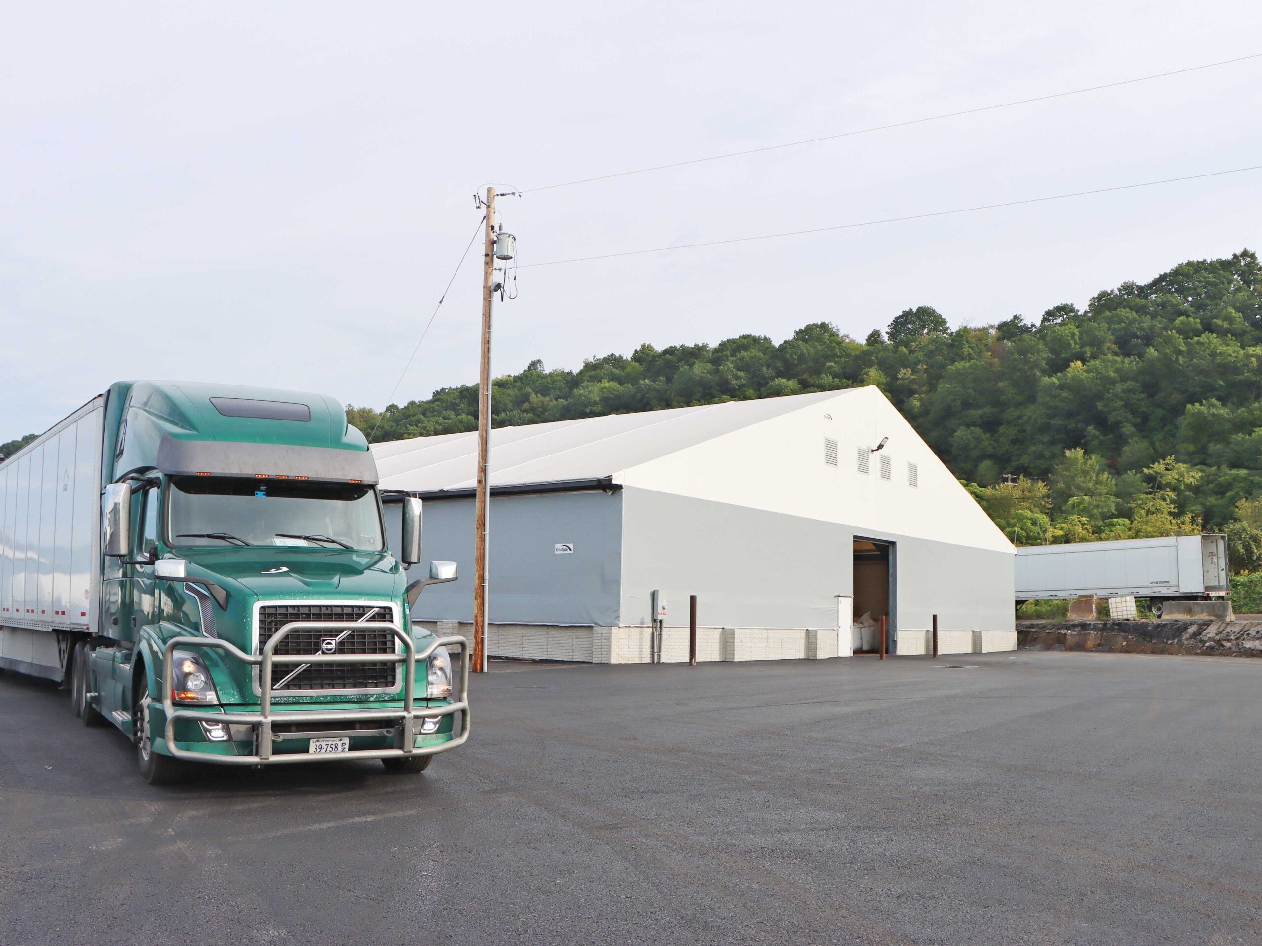 commercial truck outside fabric structure