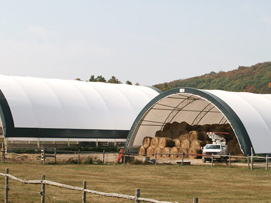 Fabric hay storage building