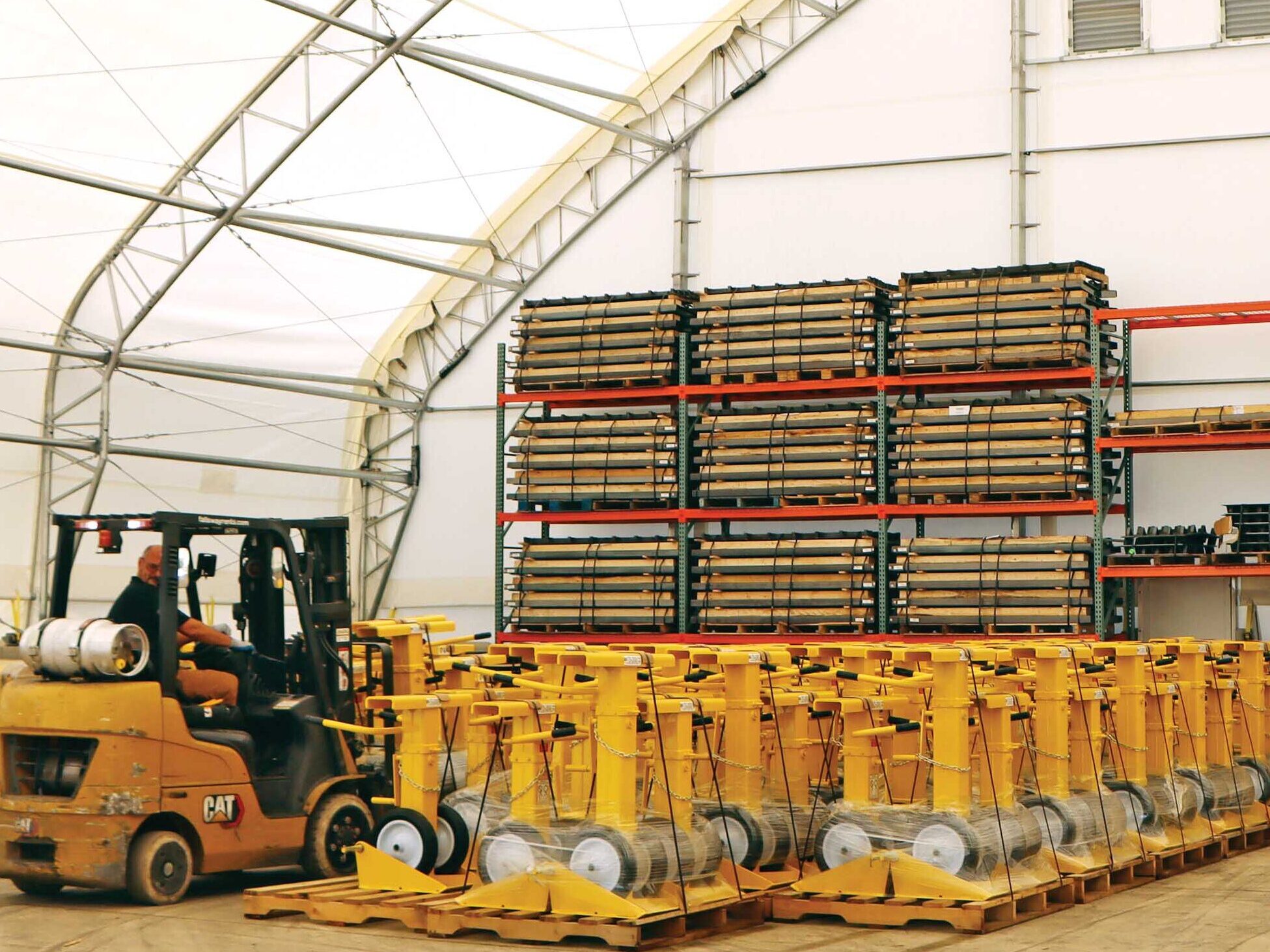 stored goods and forklift inside fabric warehouse