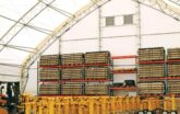 stored goods and forklift inside fabric warehouse