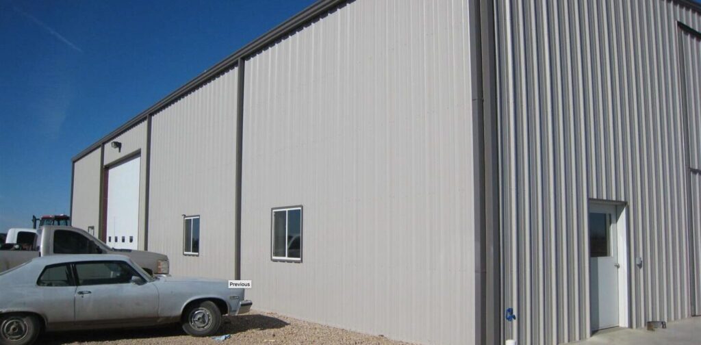 outside of insulated steel building with car