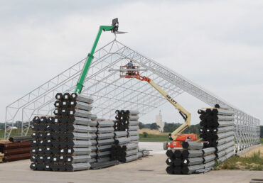 Truss building being assembled and installed