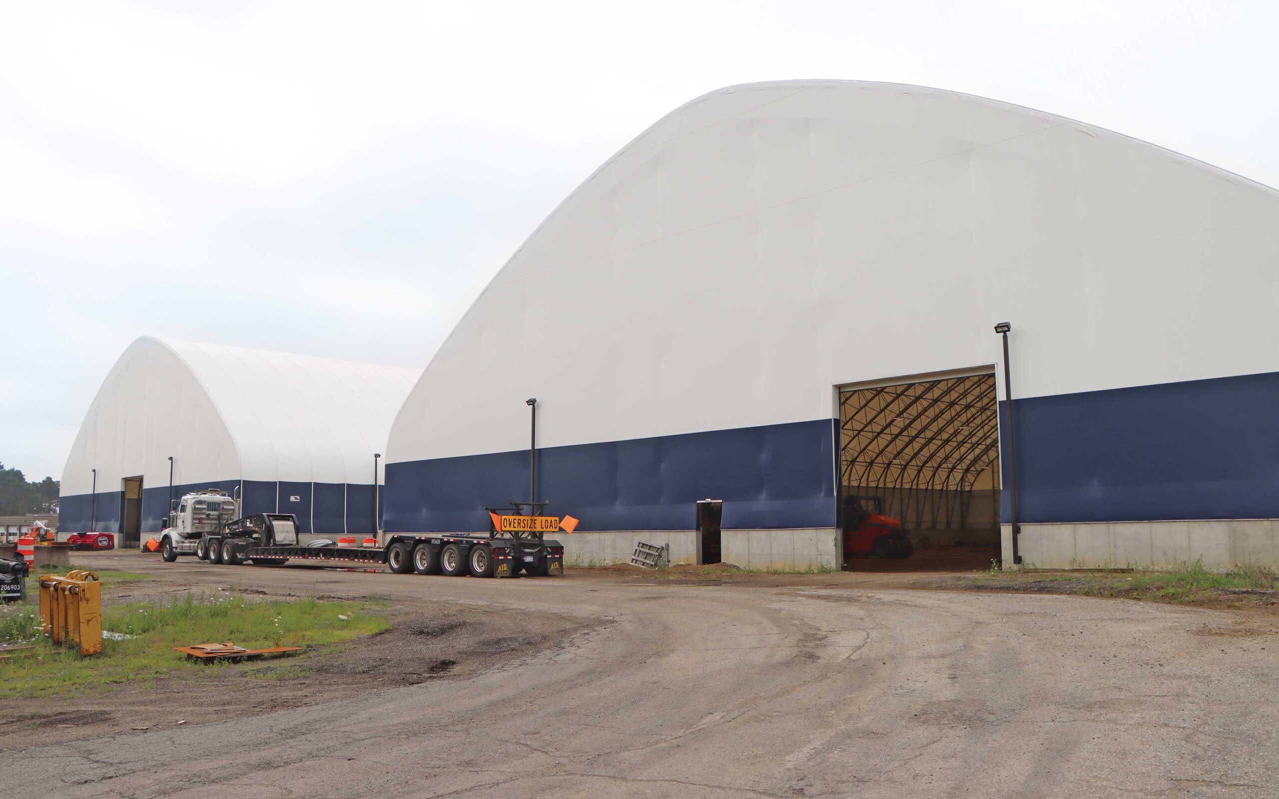 two white and blue fabric truss buildings