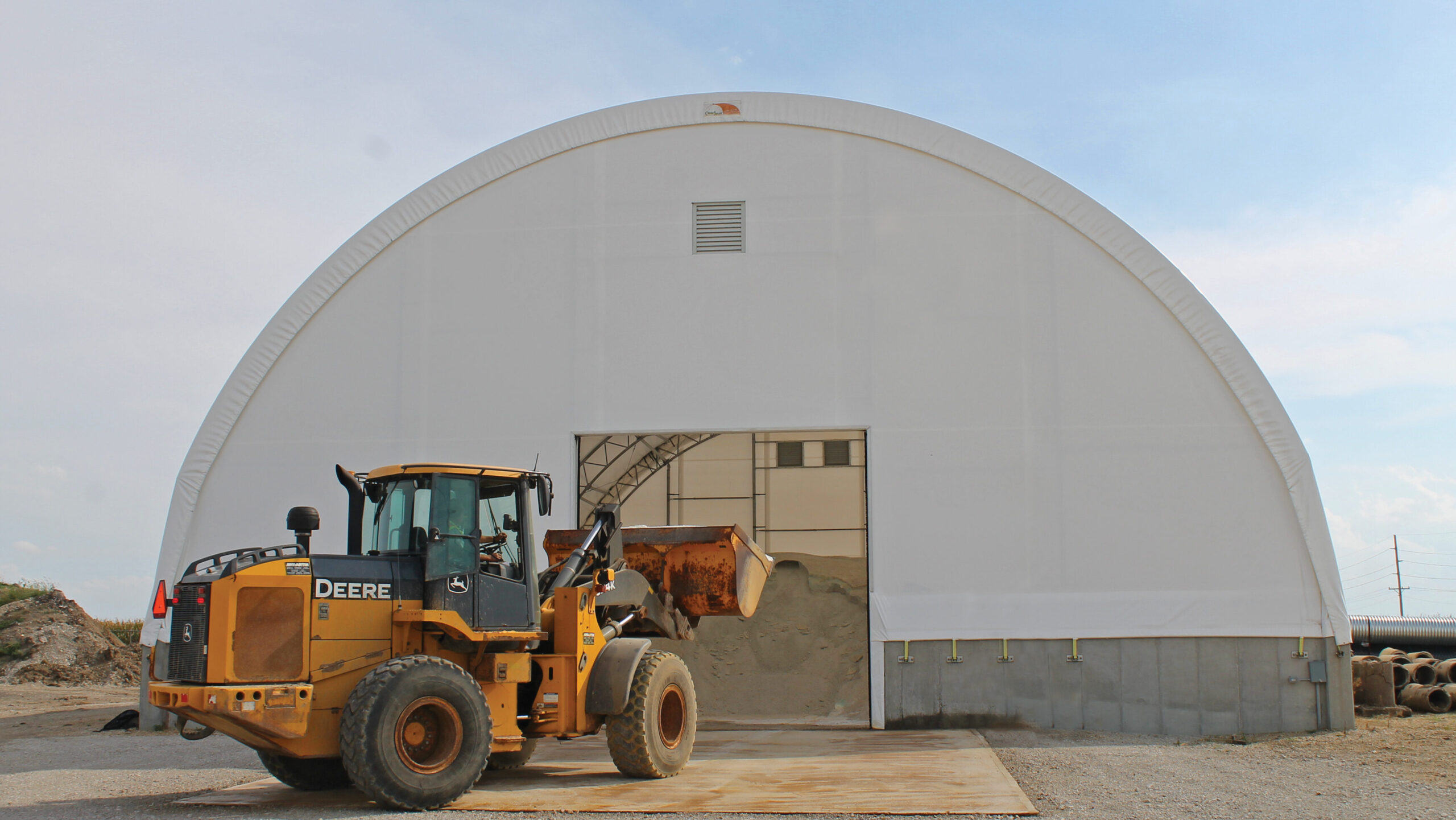 Fabric hoop building with front loader in front