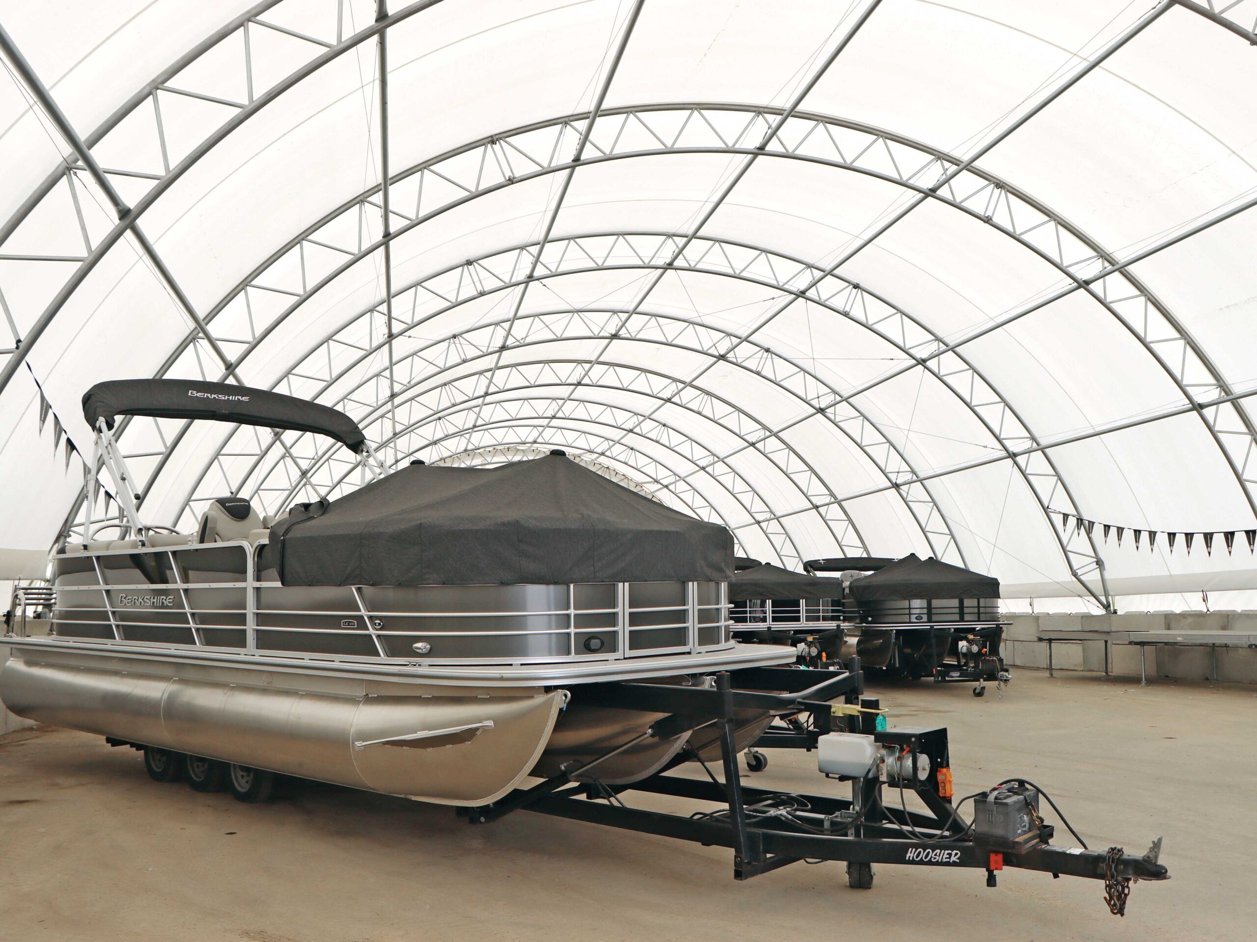 boats inside fabric marina storage structure