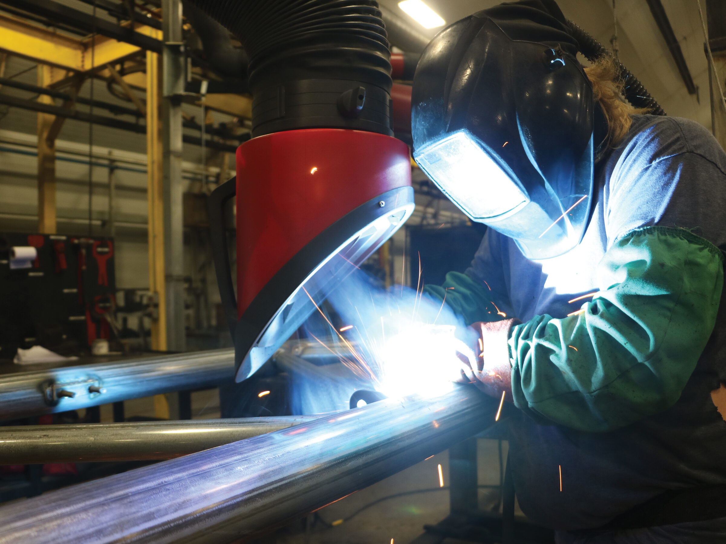 welder fabricating the frame of a commercial modular building