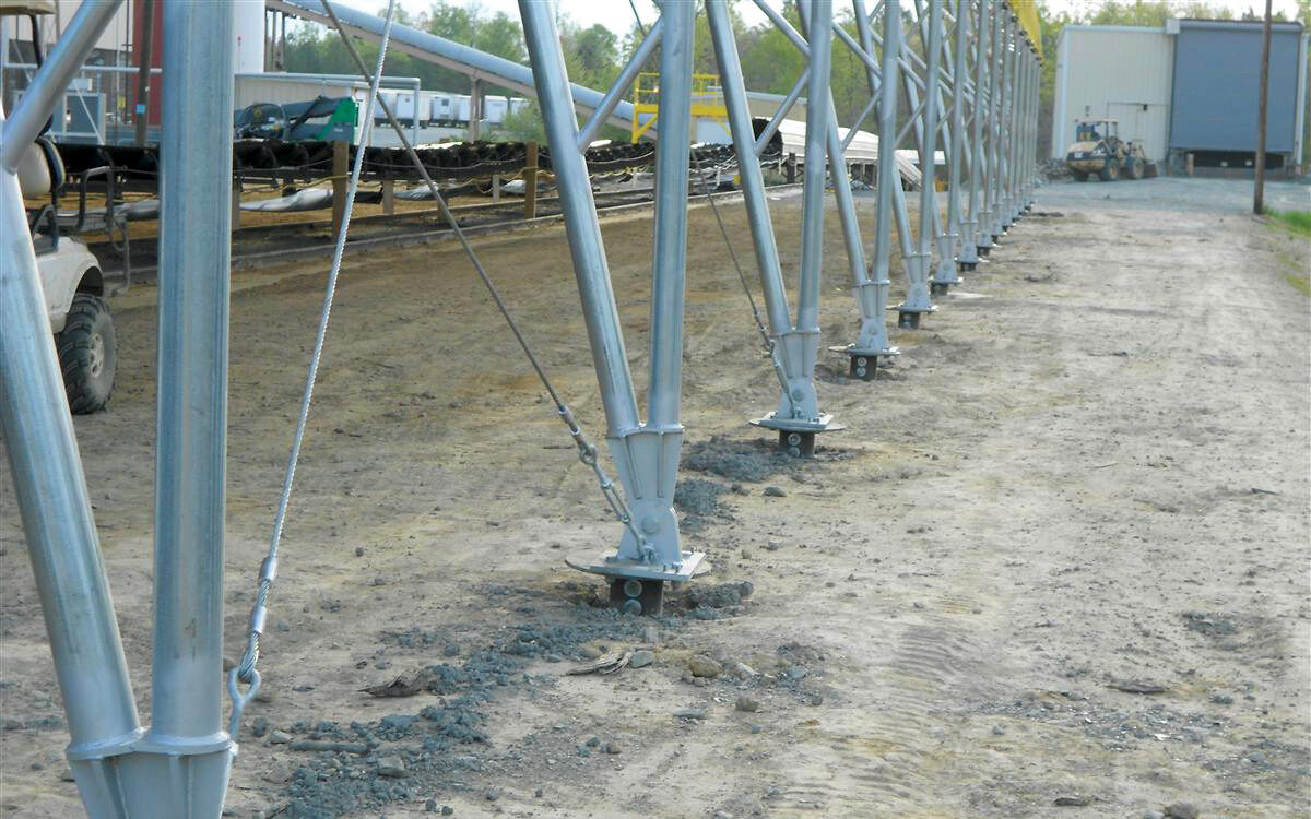 tent shed anchored into ground with helical anchors