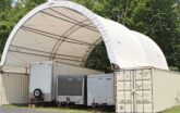 fabric tent shed with trailers stored underneath