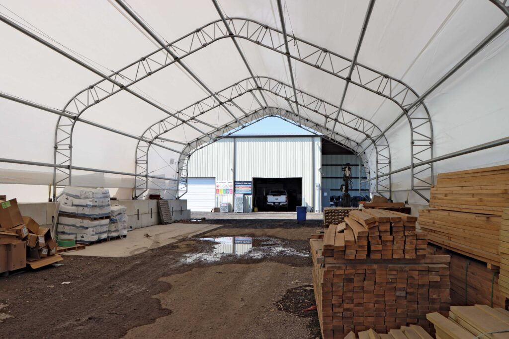 interior of tent shed with stored materials