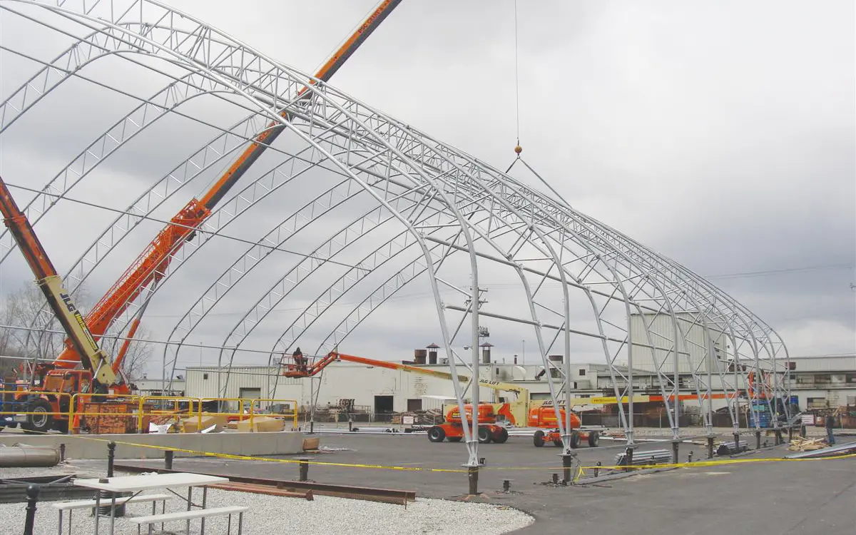 building construction materials being installed on site with crane