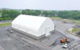 White fabric structure exterior with concrete foundation