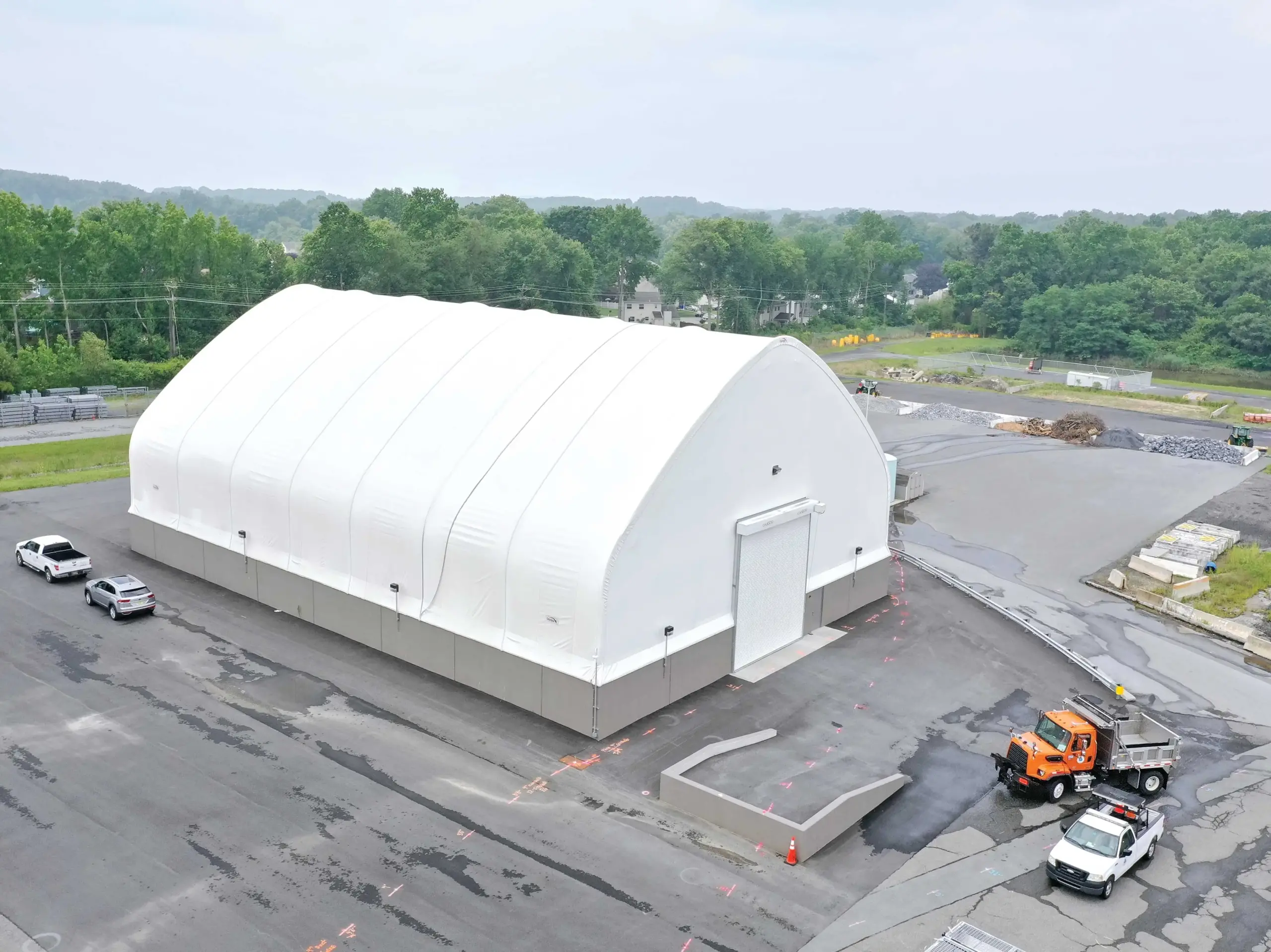 White fabric structure exterior with concrete foundation