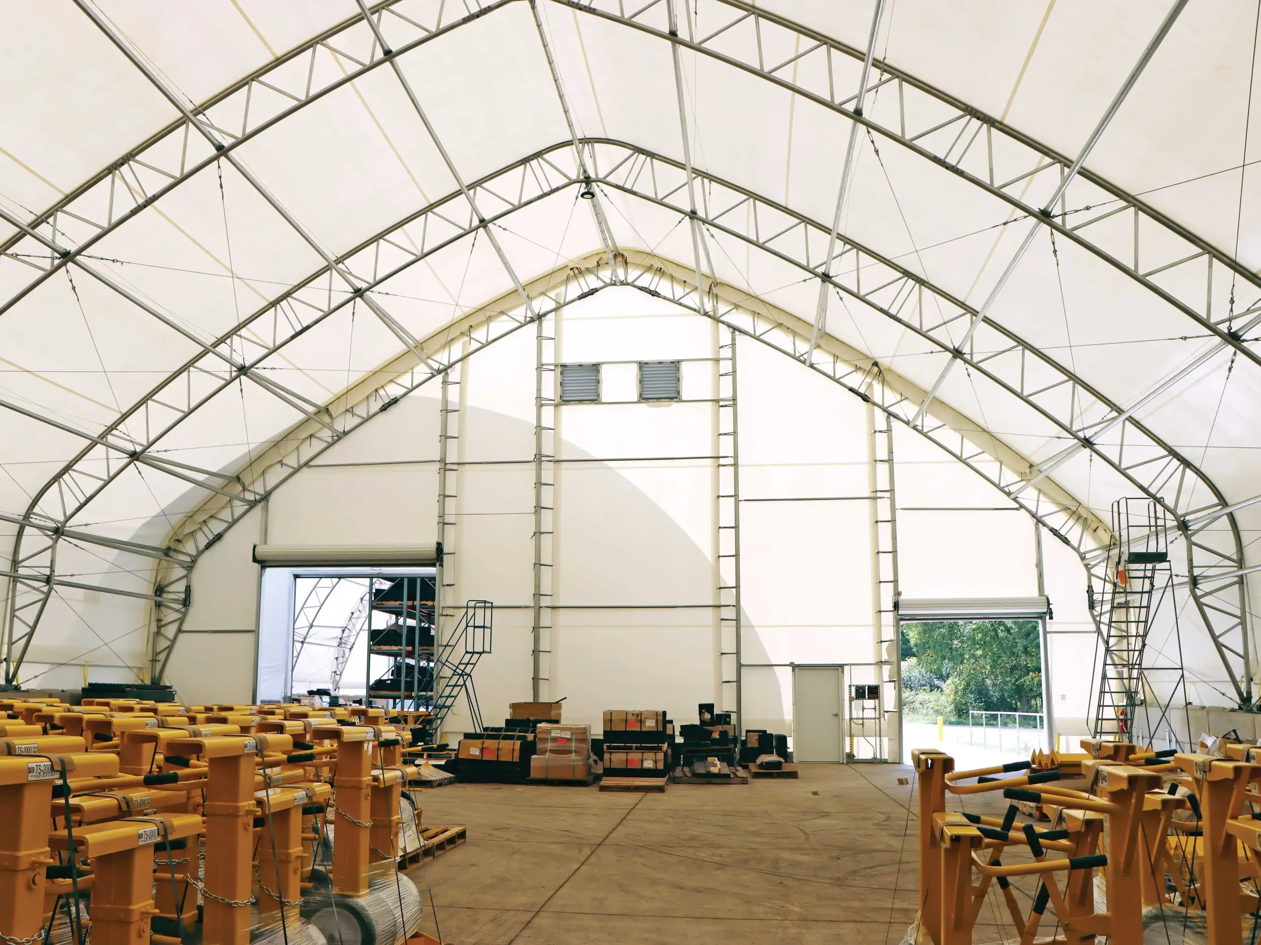 interior of a fabric warehouse building built with a truss frame