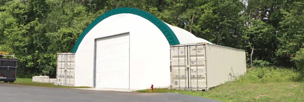 fabric shed mounted on storage containers