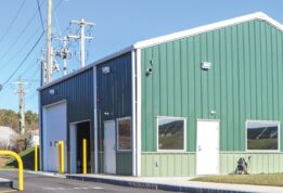 Green ClearSpan PEMB with parking gate at DOT