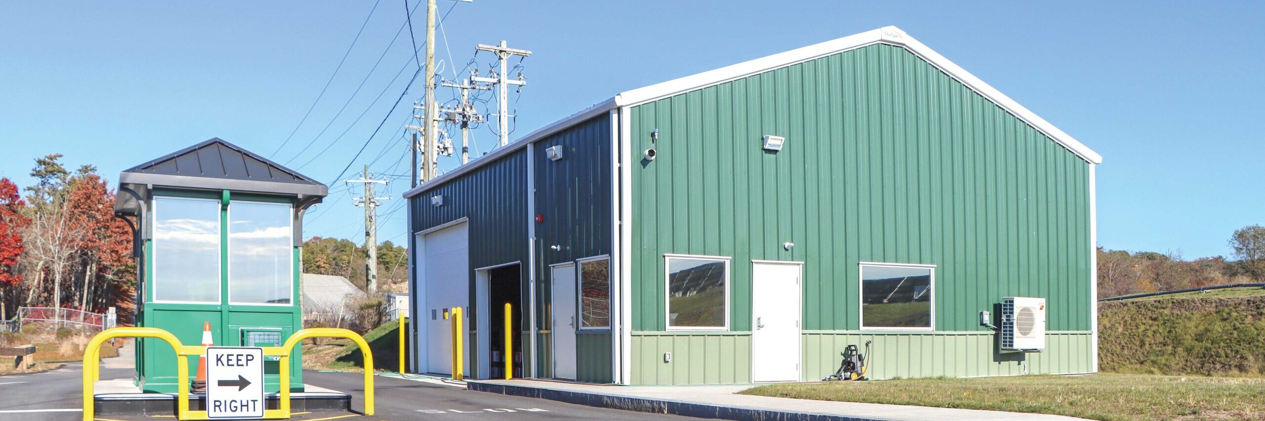 Green ClearSpan PEMB with parking gate at DOT