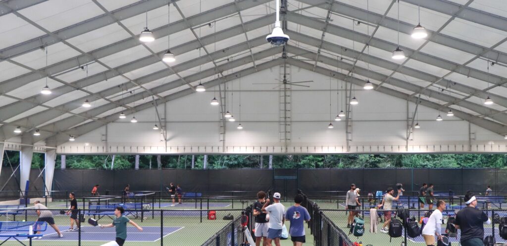 interior of I-beam Pavilion building with pickleball courts