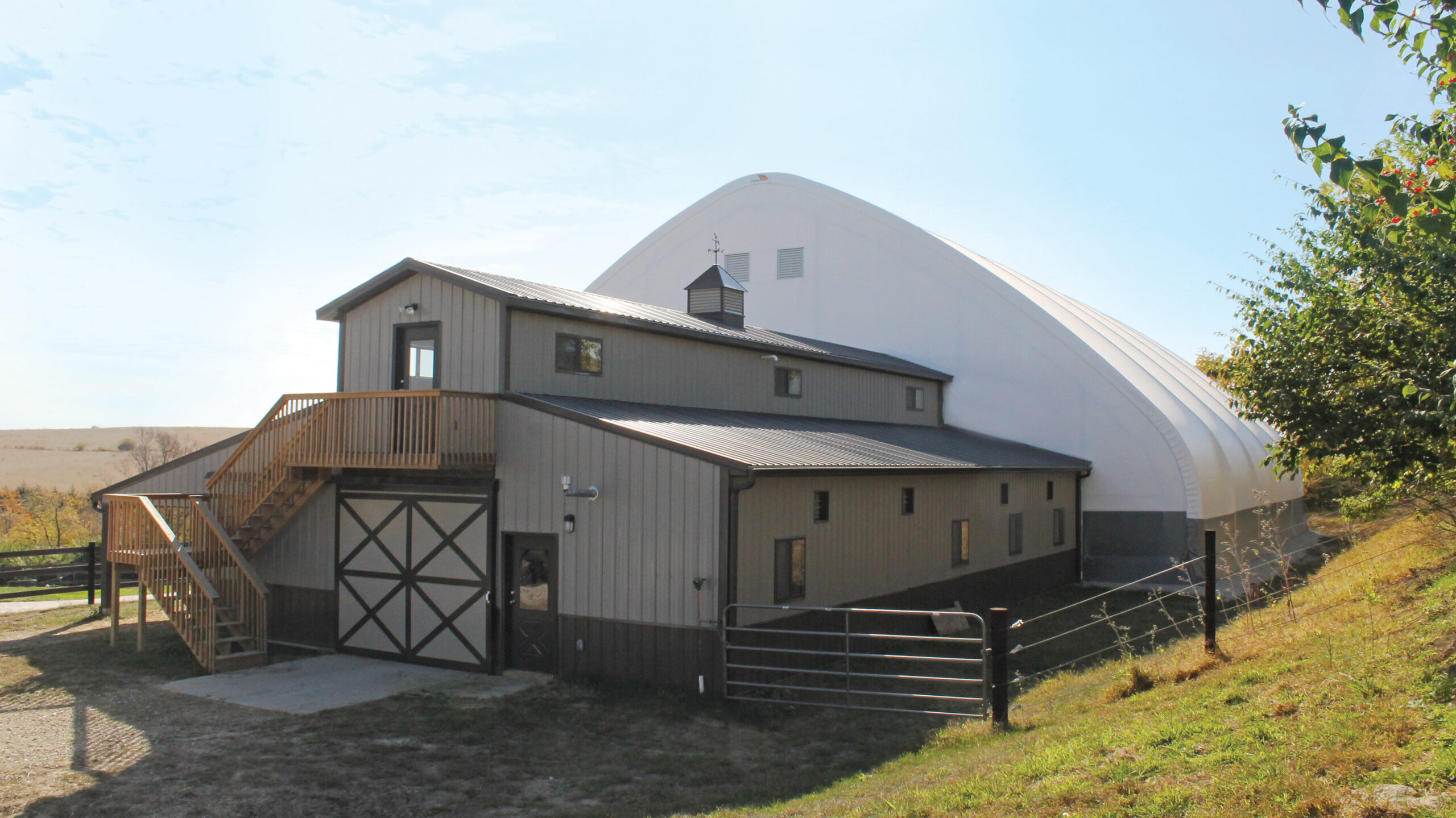 fabric building attached to back of farmhouse