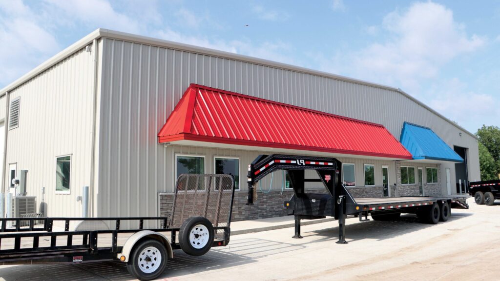 Metal building exterior with red and blue awnings