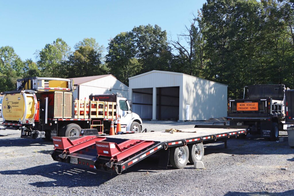 Work trucks outside of commercial building construction project
