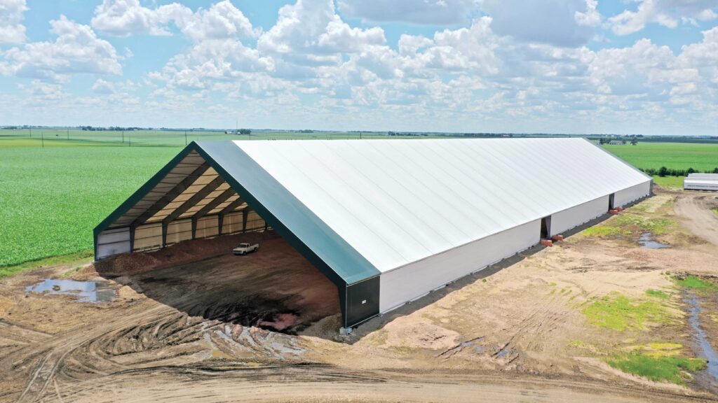 A completed ClearSpan HD Beam Building on a dirt lot directly after installation