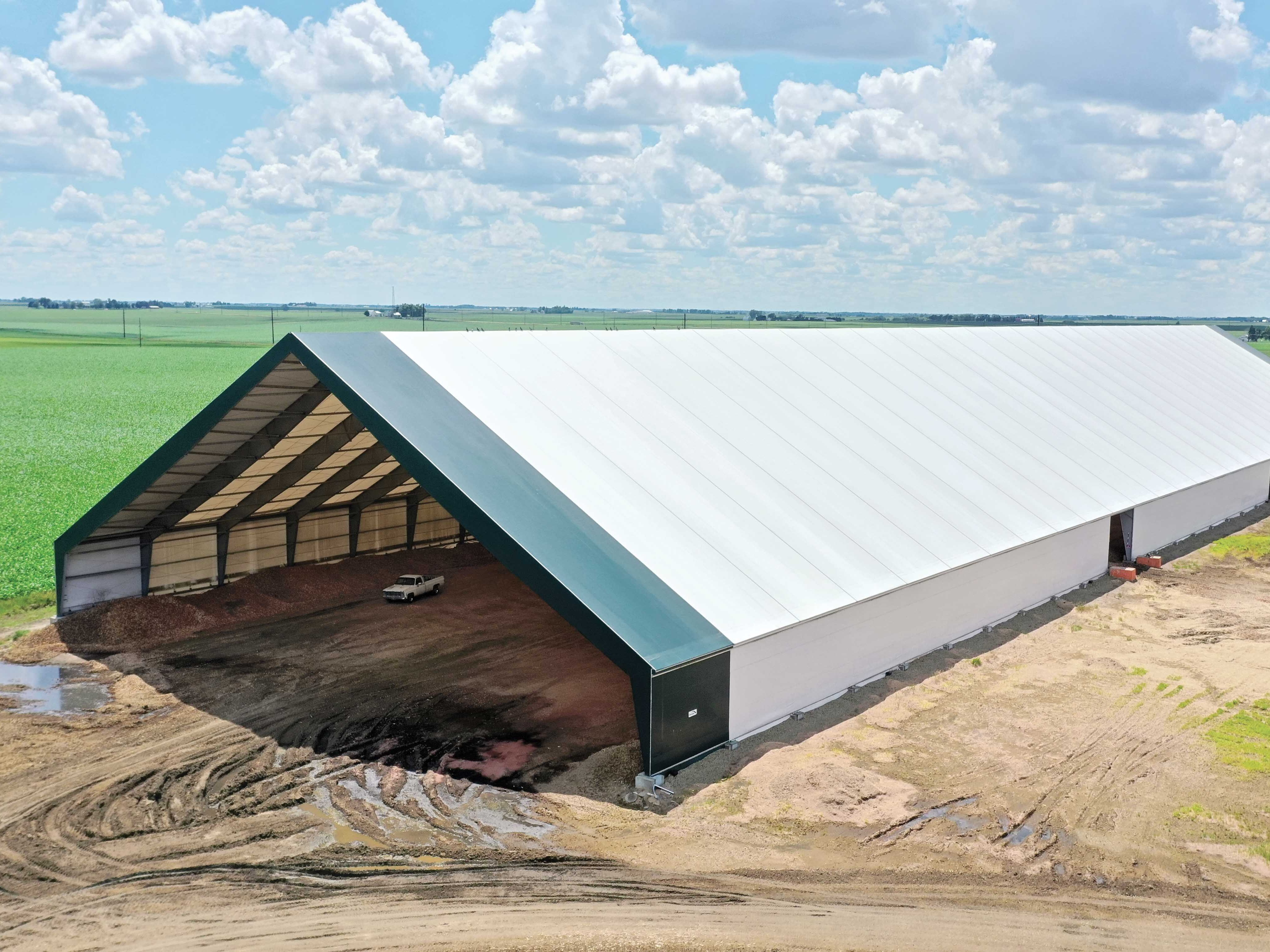 A completed ClearSpan HD Beam Building on a dirt lot directly after installation