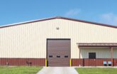 Exterior end wall of a ClearSpan PEMB with a garage door